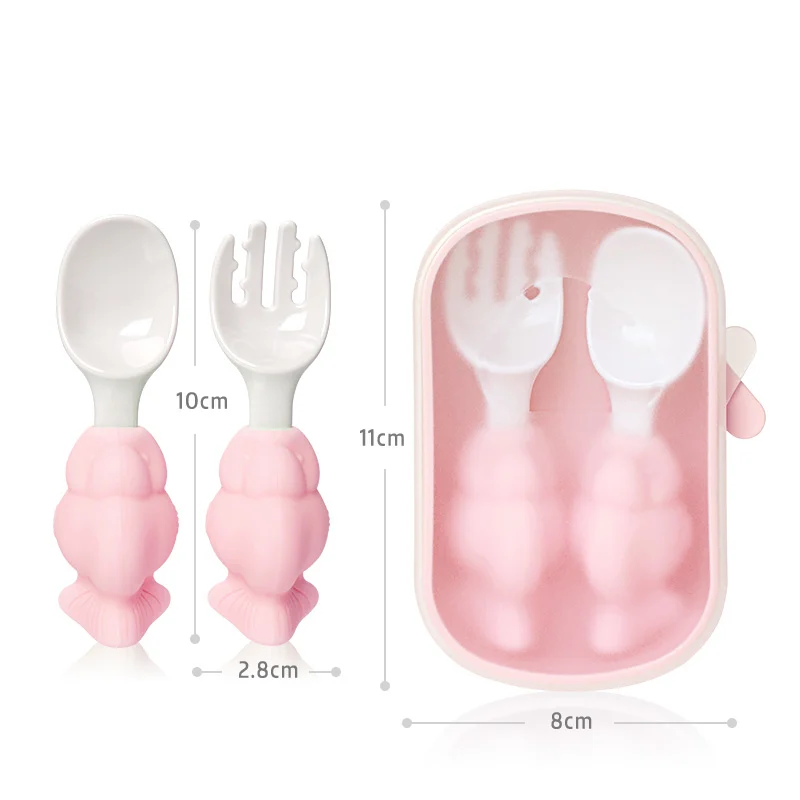Baby spoon and fork set laid flat on a white surface