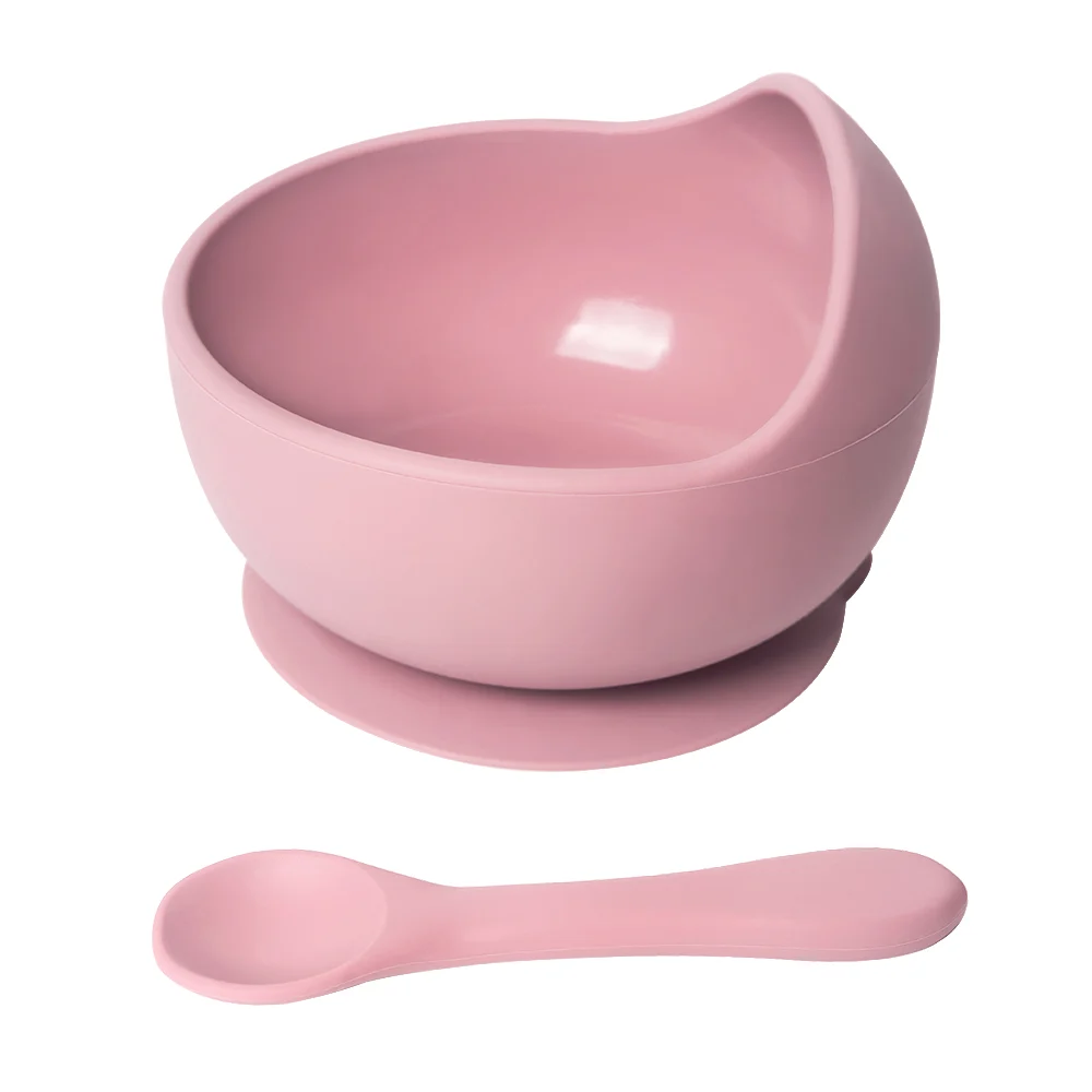 Green suction silicone bowl with spoon, showing the suction base