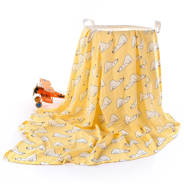 White bamboo cotton swaddle blanket used as a stroller cover