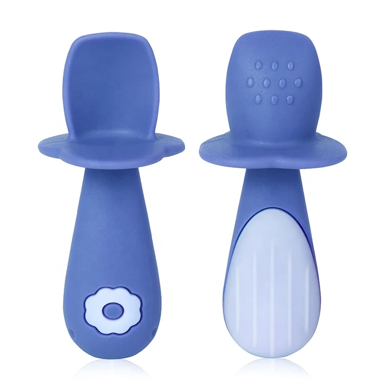 Green silicone baby spoon with sensory bumps on the bowl