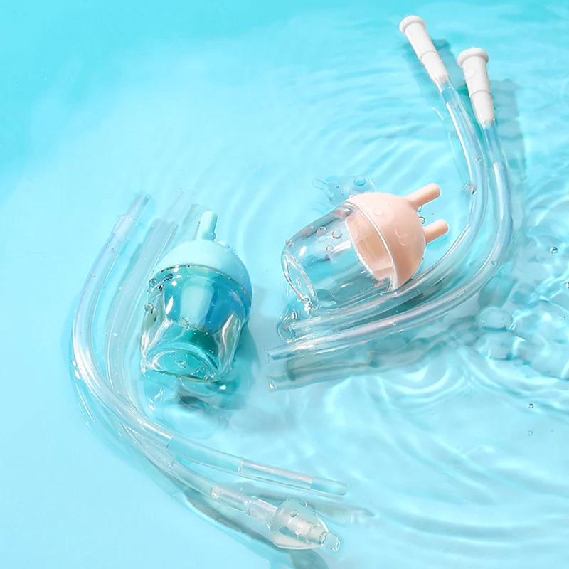 Nasal aspirator lying on a white surface with the collection trough visible