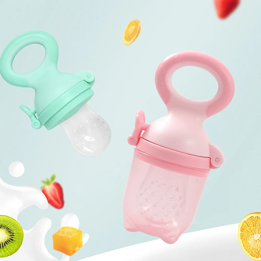 Pacifier with the lid closed, held in a baby's hand