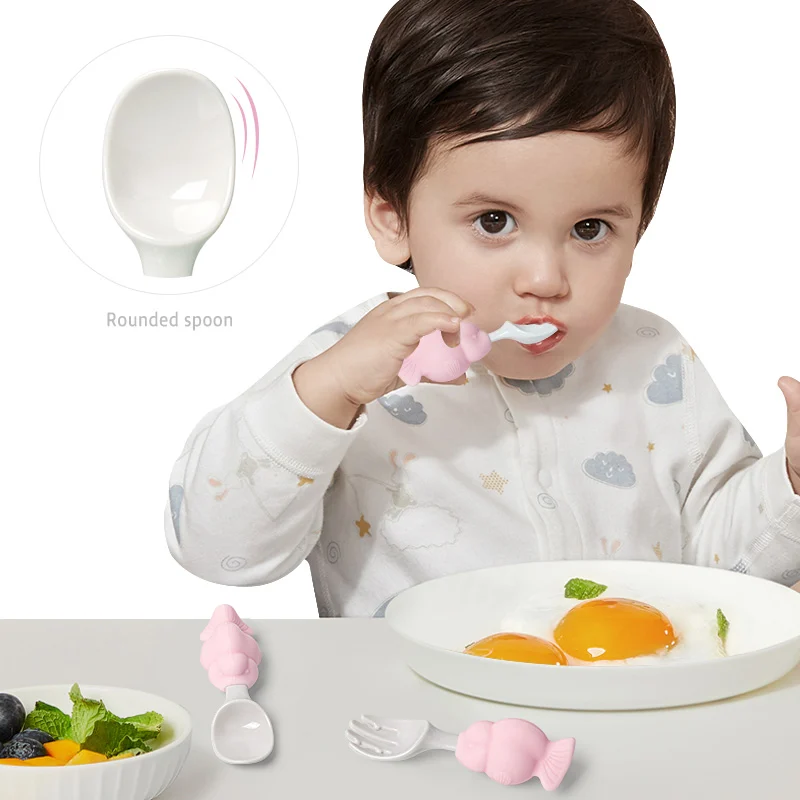 Close-up of the concave spoon head and bent fork tines holding food