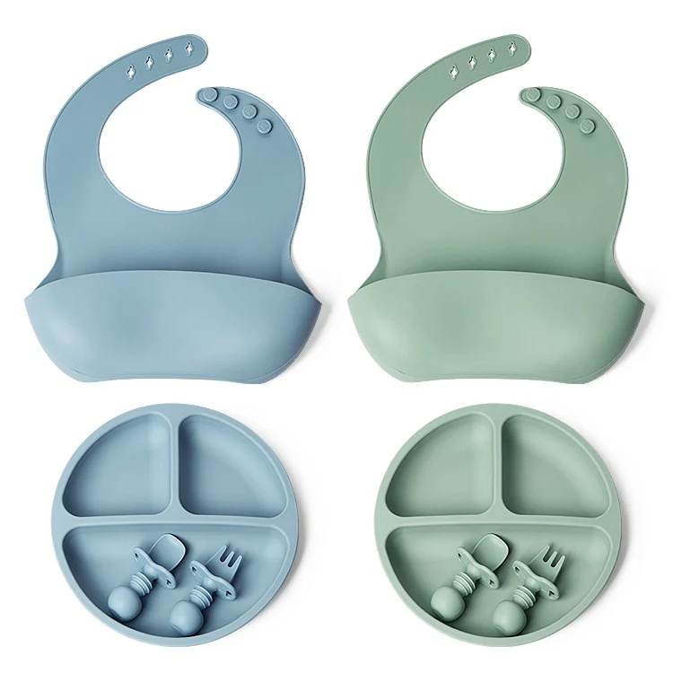 Bib worn on a baby mannequin, showing chin guard and fit