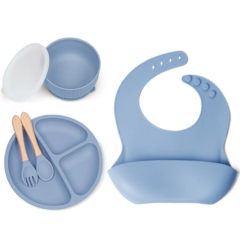 Bib with adjustable strap, showing the large pocket and 30cm width