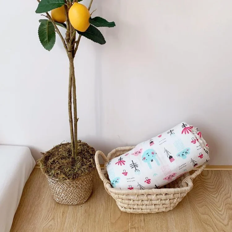 Yellow 6-layer gauze cotton muslin swaddle blanket used as a nursing cover