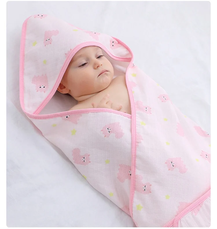 Blue cotton swaddle blanket with lace-up closure open, showing interior fabric