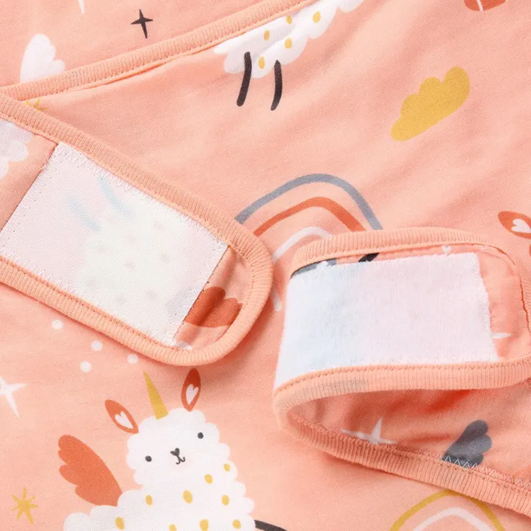 Cotton swaddle blanket used as a crib wrap with baby sleeping inside