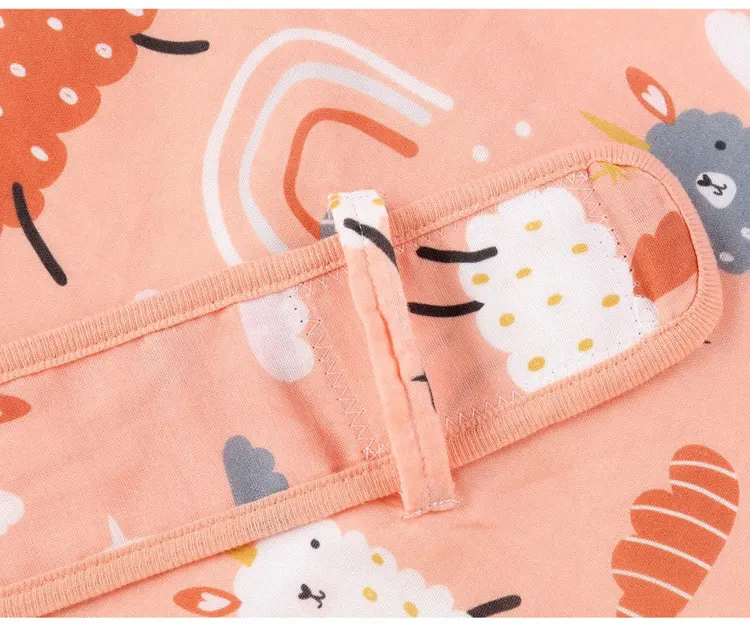 Cotton swaddle blanket with lace-up closure fully tightened around a baby model