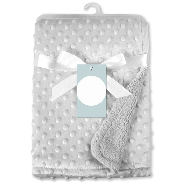 Yellow newborn receiving blanket with dotted backing, shown from the back