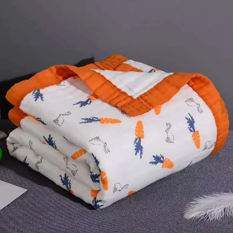 Baby blanket placed on a changing table with a baby