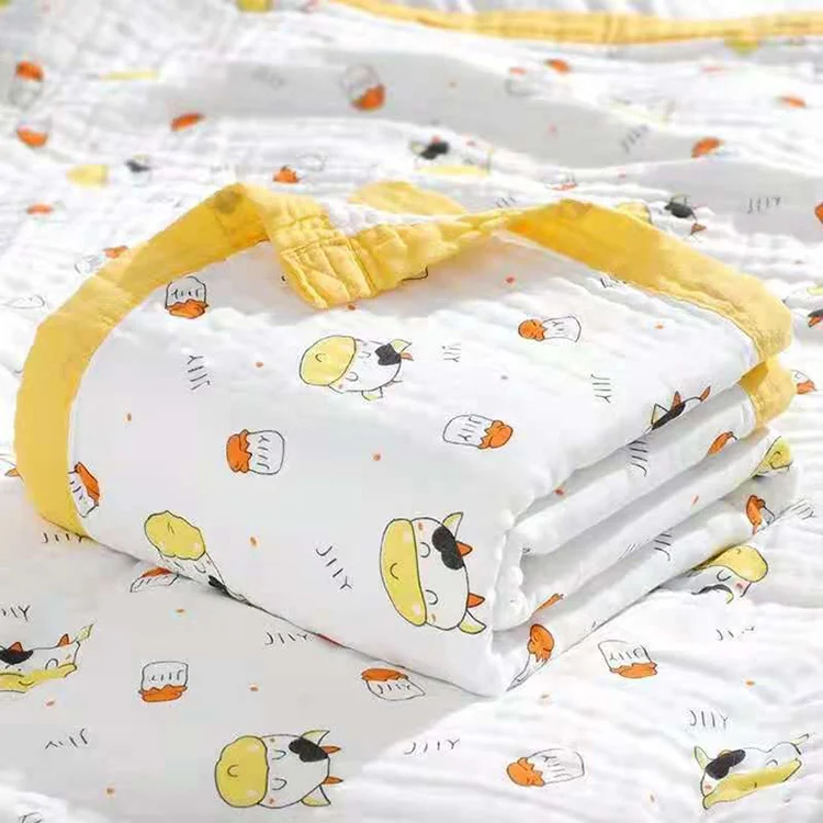 Baby blanket with a baby wrapped in it, showing the 6-layer gauze texture