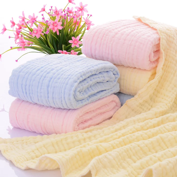 Beige 6-layer knitted baby blanket laid out with edges visible