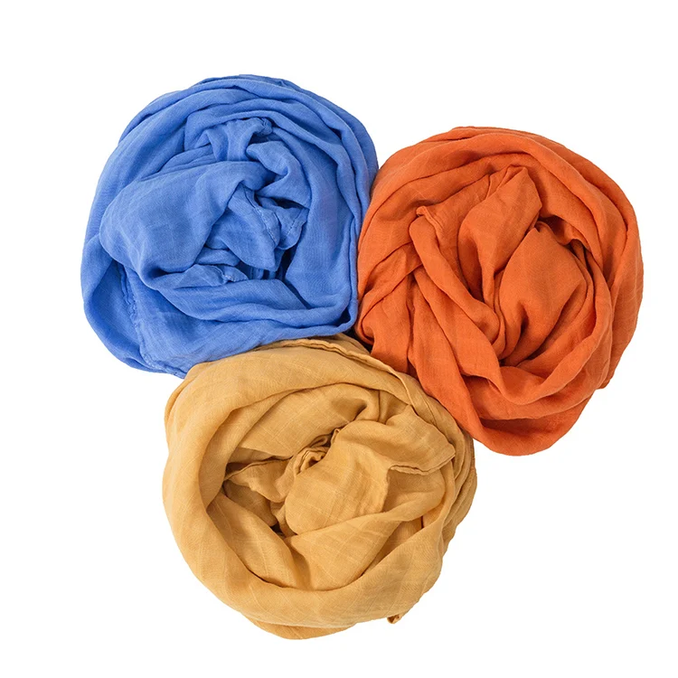 Swaddle blanket laid out for tummy time with baby