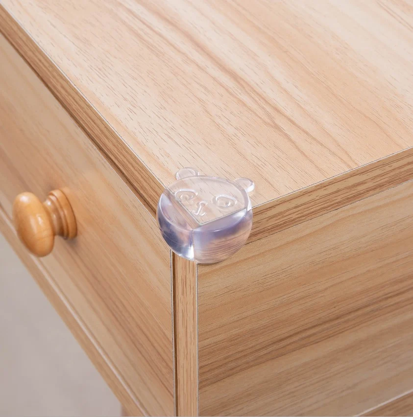 Bear-shaped corner protector next to the transparent L-shaped guard