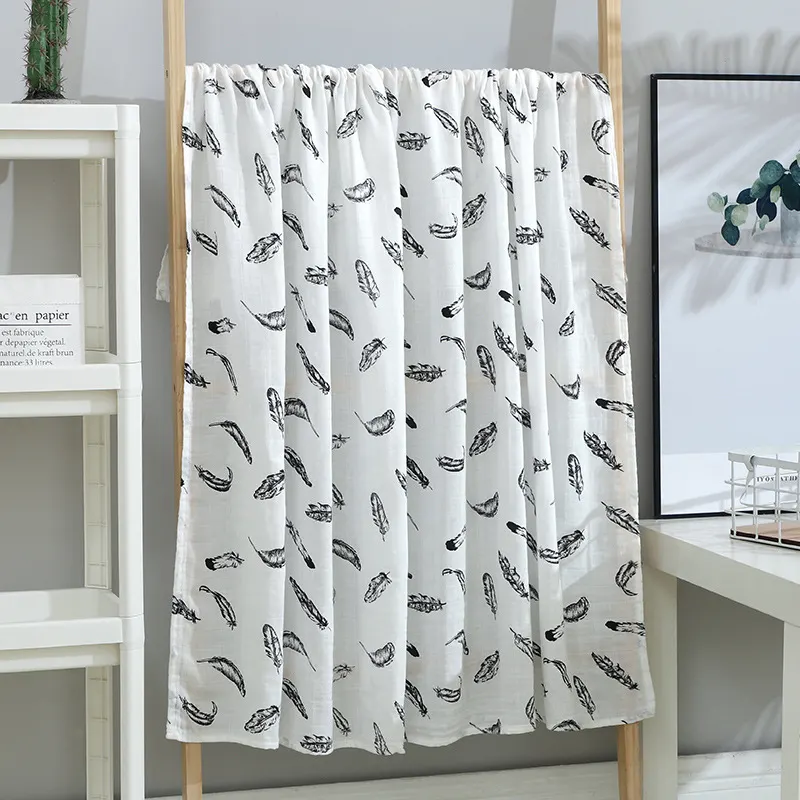 Pink cartoon-patterned 2-layer bamboo cotton muslin swaddle blanket laid flat