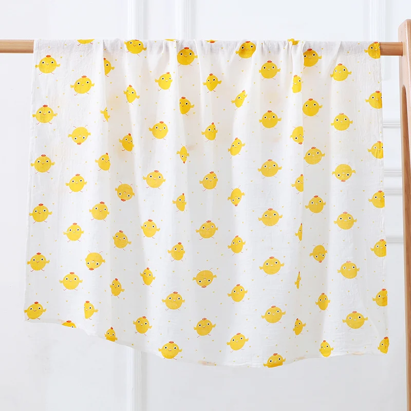115x110cm bamboo cotton muslin swaddle blanket in plant pattern, folded and laid flat