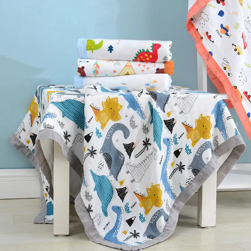 Blue 4-layer bamboo cotton swaddle blanket with marine pattern, laid flat