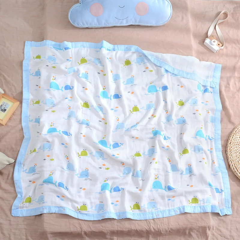Red 4-layer swaddle blanket with cartoon pattern, shown as a nursing cover
