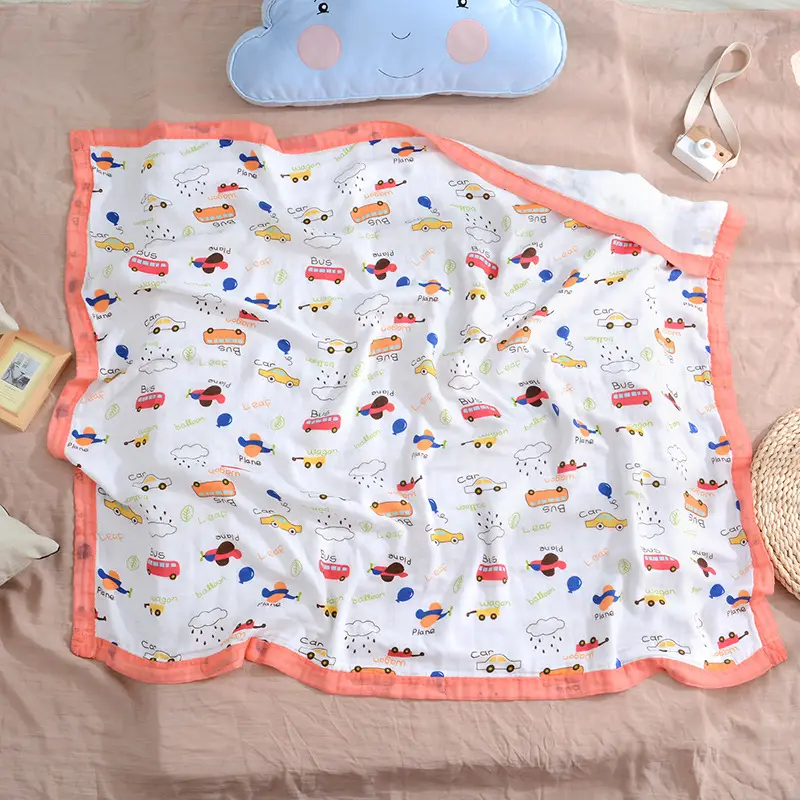 White 4-layer swaddle blanket with floral design, used as a car seat blanket