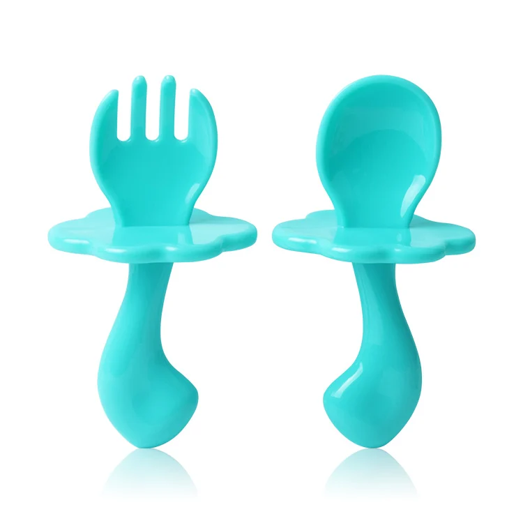 Green baby feeding spoon and fork set with short, wide handles
