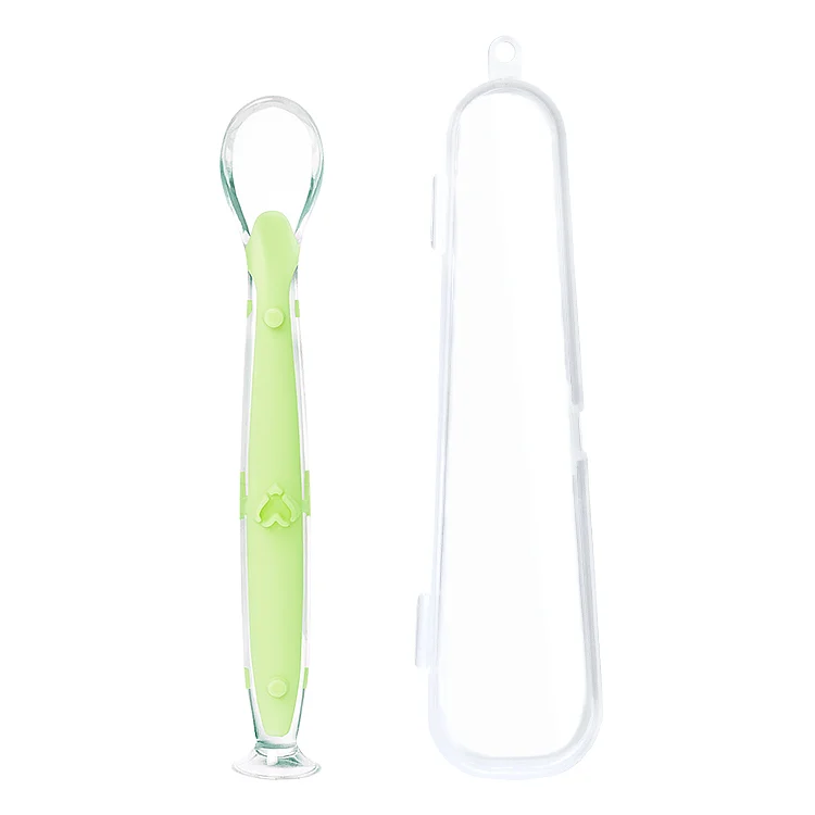 Spoon with suction cup removed, showing the base and flexible body