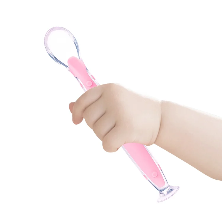 Spoon placed on a clean surface with the suction cup fully adhered