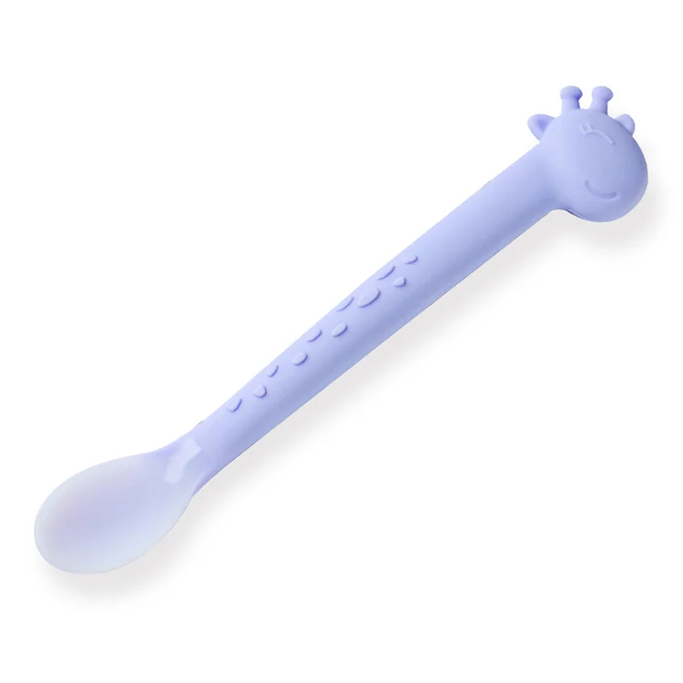 Feeding spoon held in small hand, demonstrating easy grip