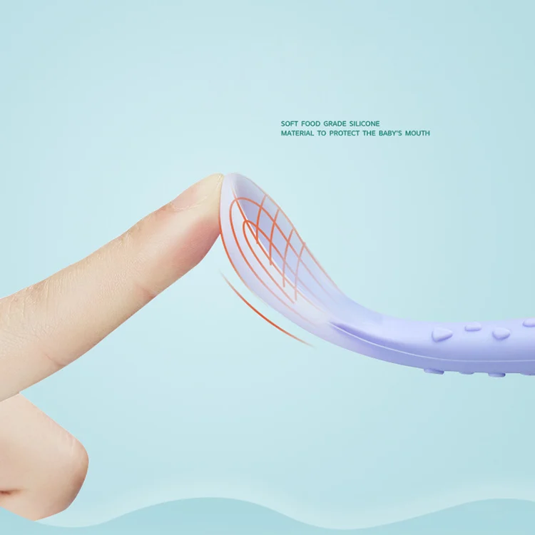 Feeding spoon in blue, with handle and textured base in focus