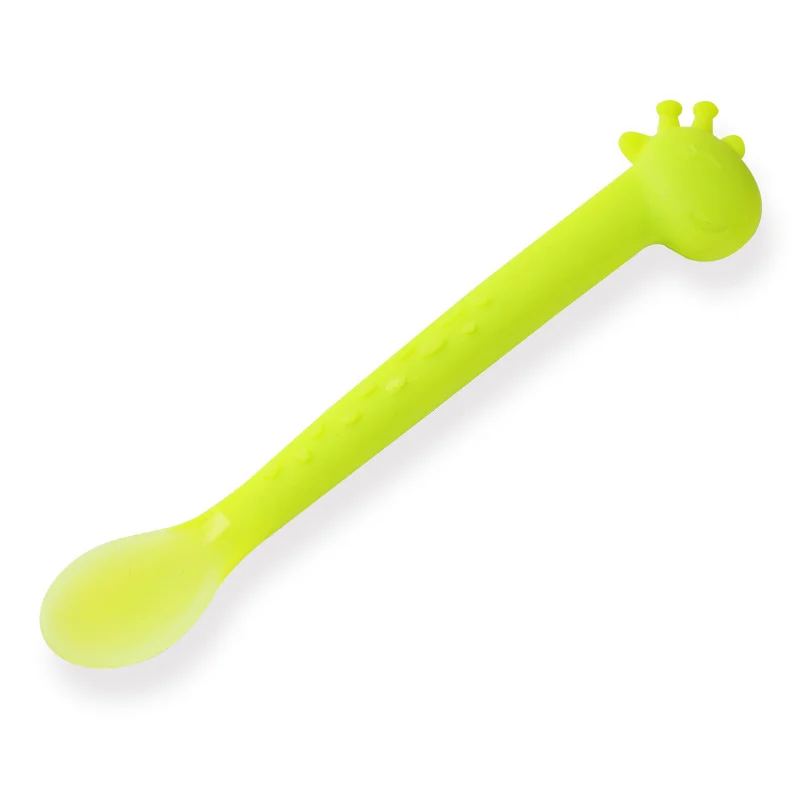 Close-up of the textured base of the feeding spoon, designed for teething