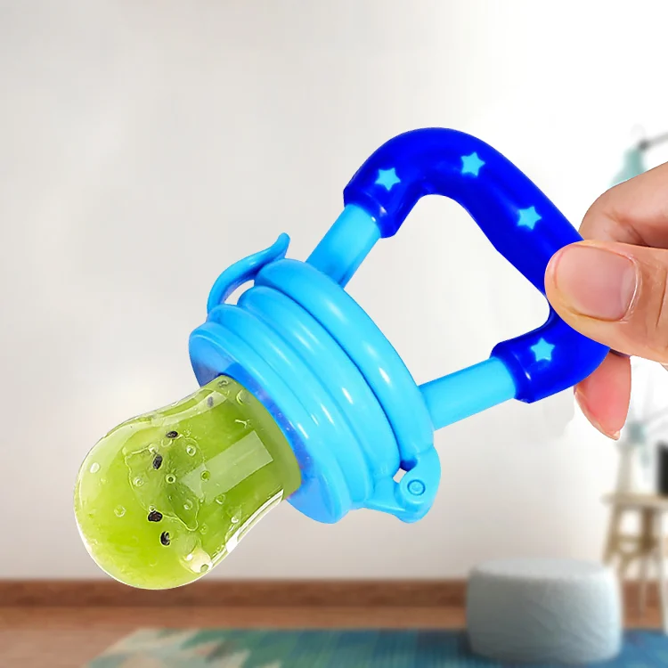 Feeder with ice cubes in the spoon, showing use as a teether for teething relief