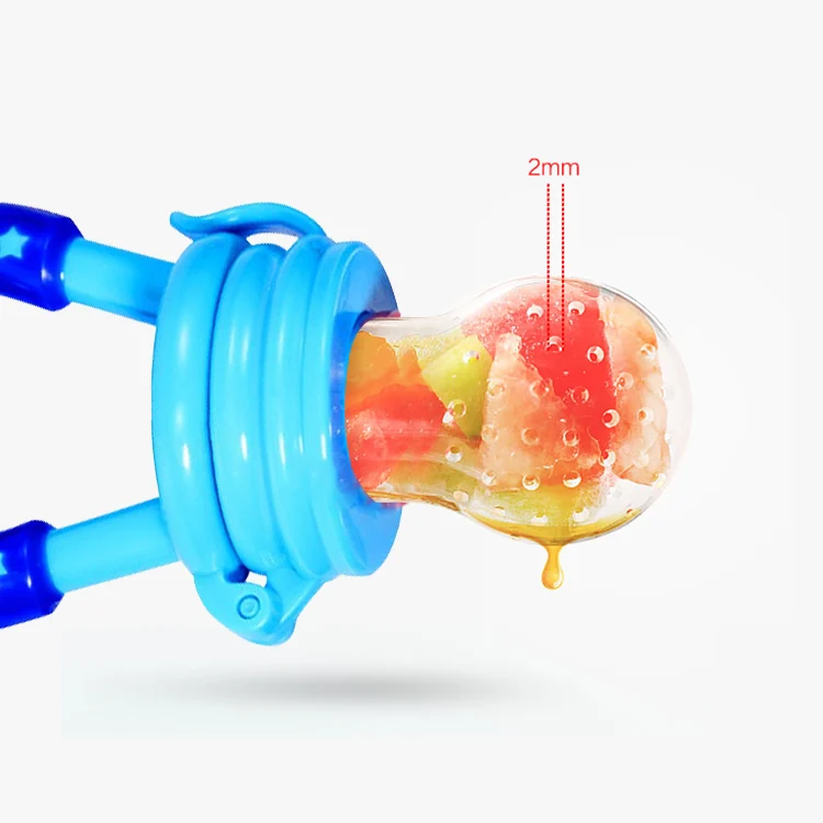 Silicone feeder held in small hands, demonstrating grip and feeding action