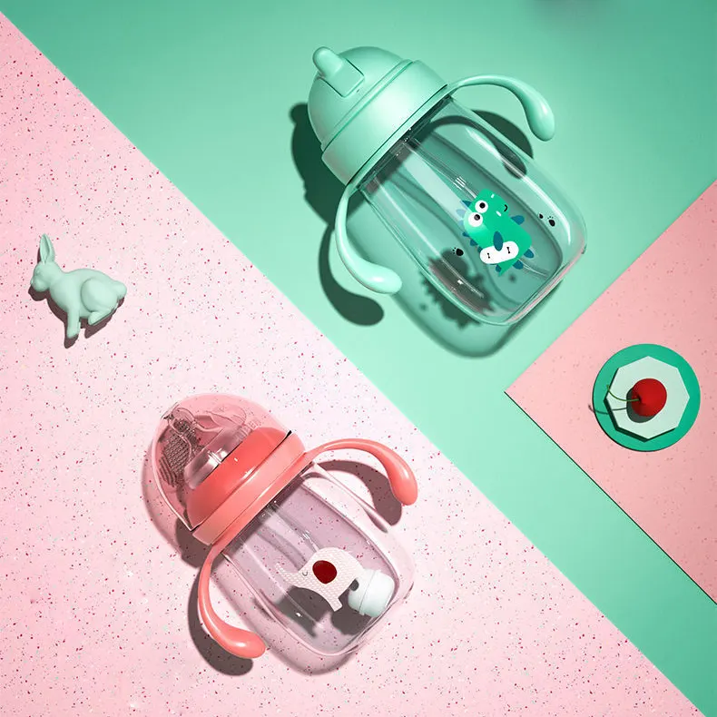 Baby feeding bottle with cross-cut nipple and drinking cap removed