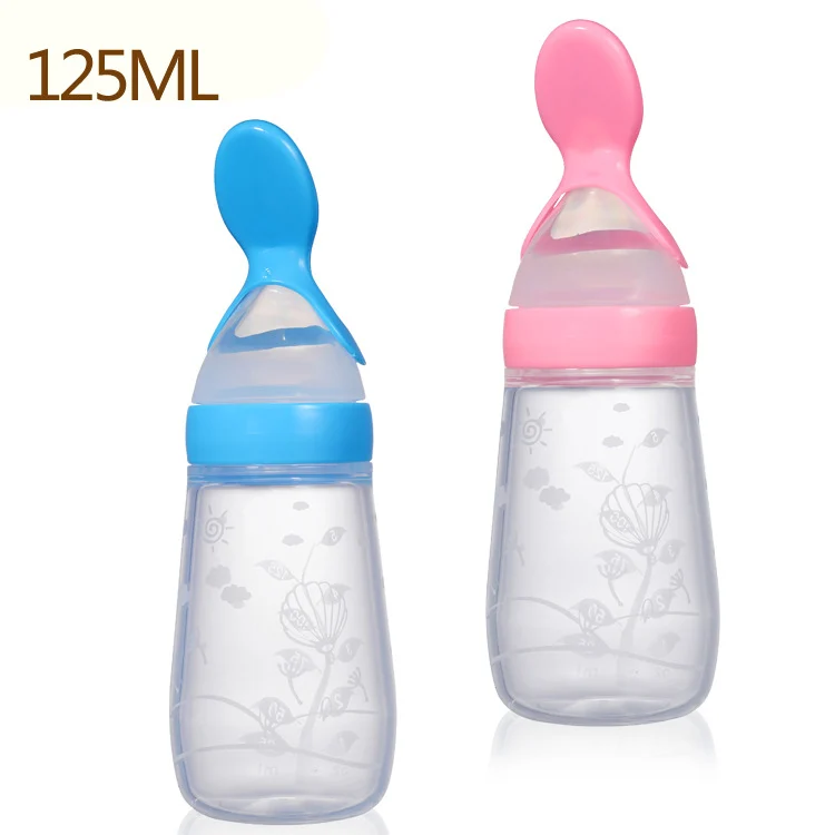 Blue 125ml silicone squeeze feeder standing upright with cap and spoon attached