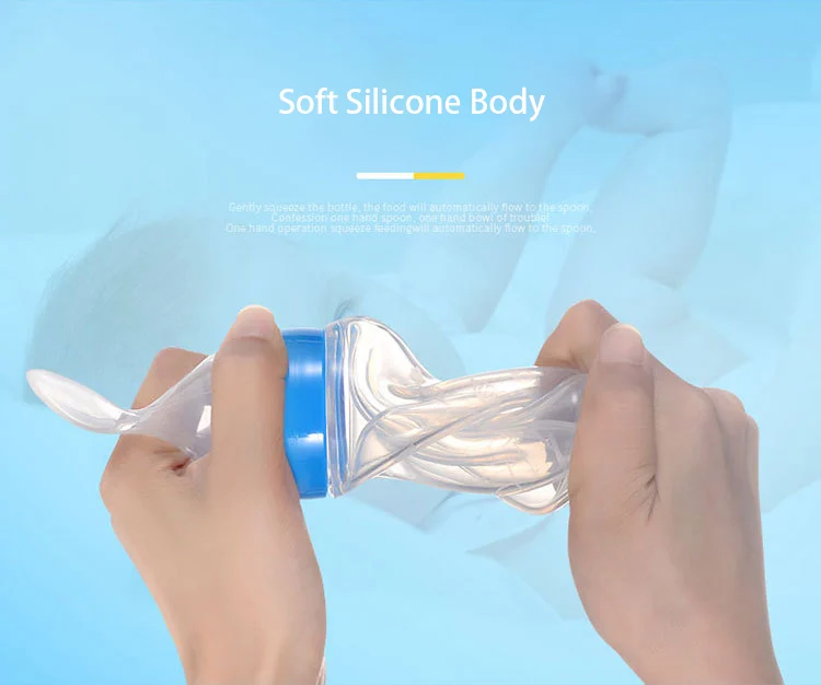 Squeeze feeder in use, feeding baby with food dispensed onto the spoon
