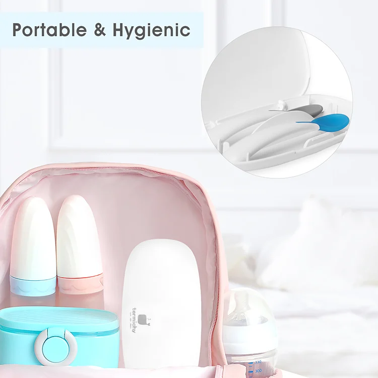Blue spoon and fork set with the heat-sensitive tip in warm water