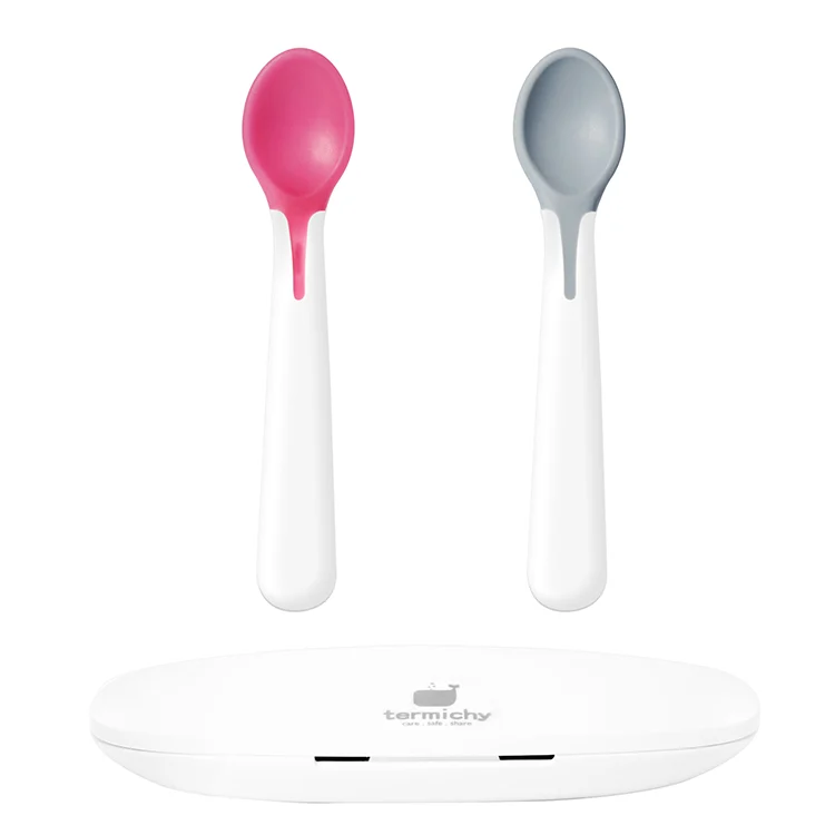 Purple baby spoon and fork set with heat-sensitive tips in a travel storage box