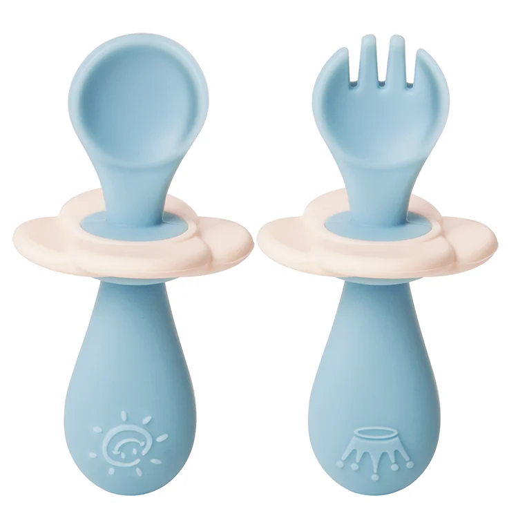 Blue infant silicone fork and spoon set with baffle attached, standing upright