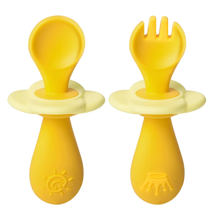 Orange infant silicone fork and spoon set with baffle removed, showing rounded spoon head