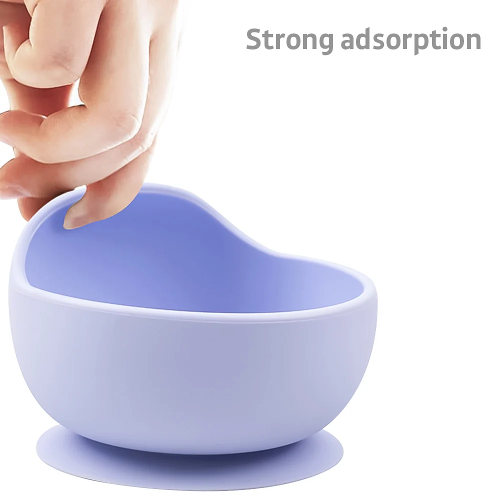 Purple silicone bowl with spoon, close-up of suction base