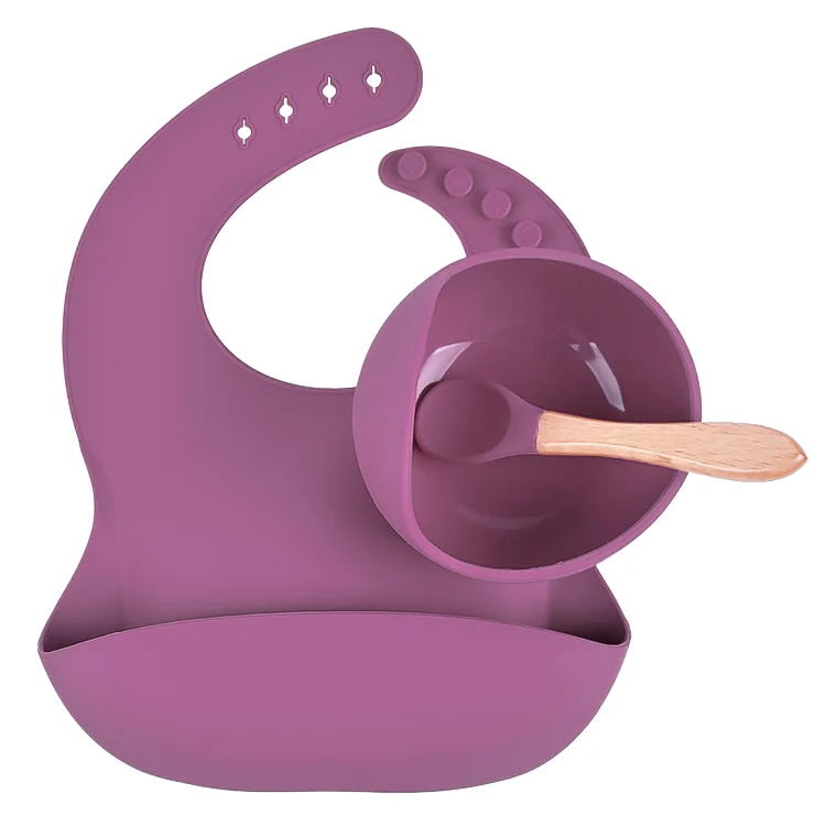 Spoon and bib components separated from the bowl, showing construction