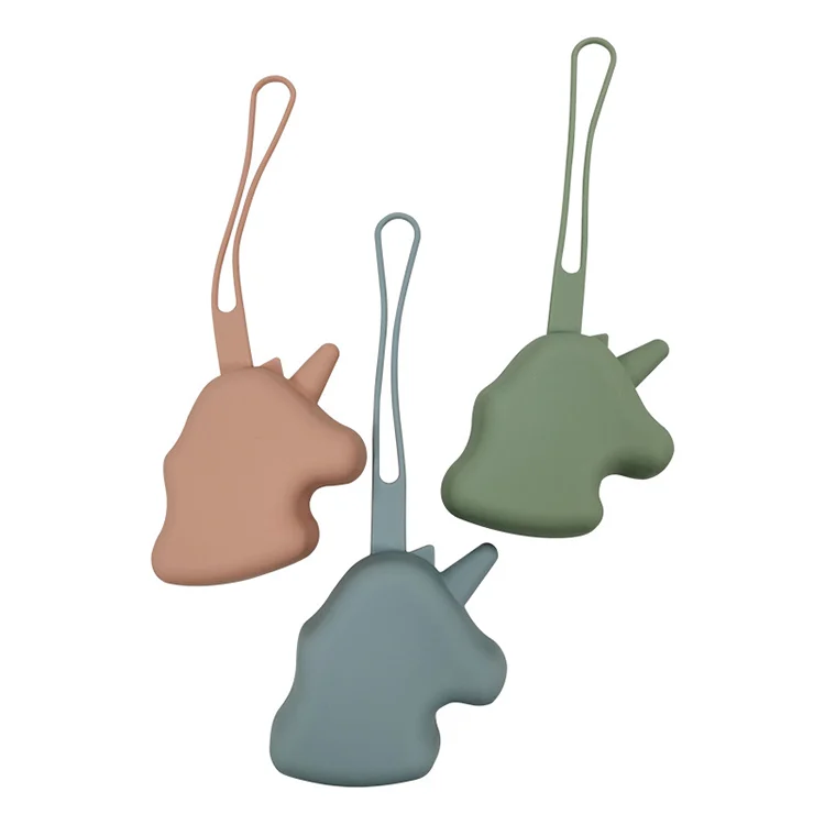Pink unicorn-shaped silicone pacifier holder with a built-in strap
