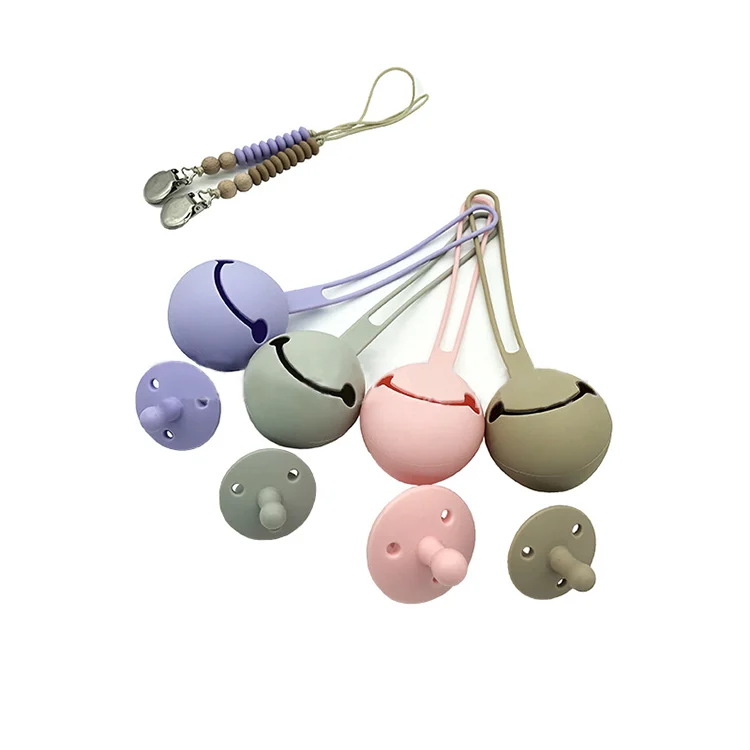 Silicone pacifier case in pink with strap looped around a stroller handle