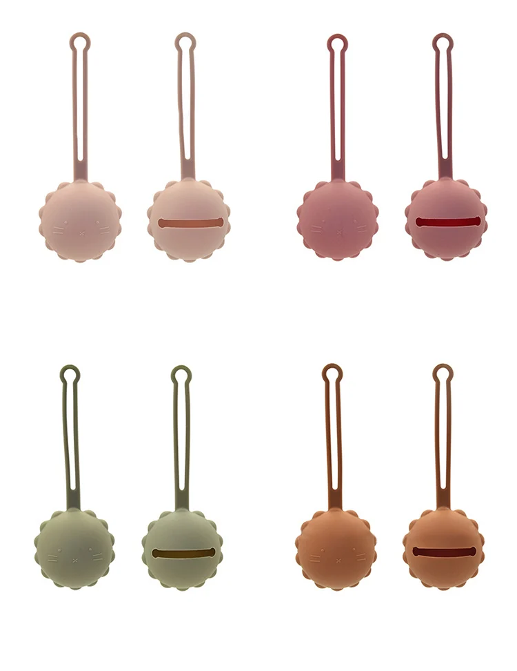 Silicone pacifier holder in a stack of three different colours