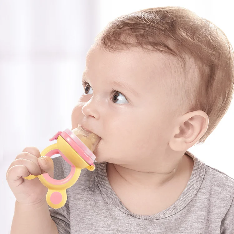Pacifier lying flat on a surface with all three nipples visible