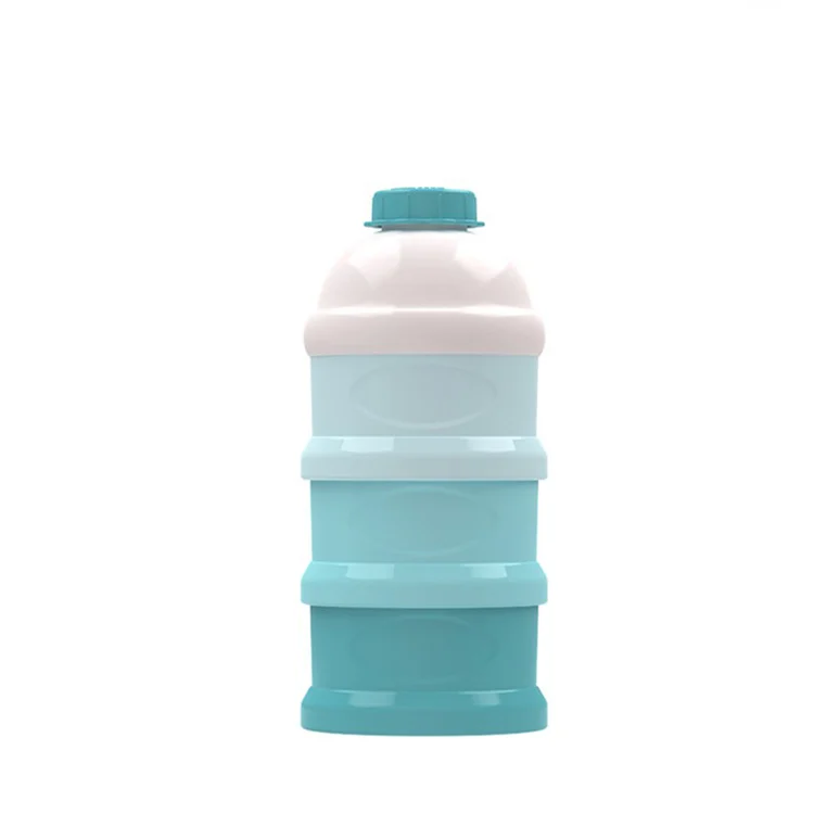 Container in use with formula and a baby bottle nearby