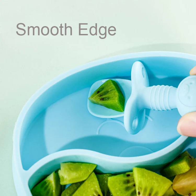 Bowl with suction base pressed down on a highchair tray