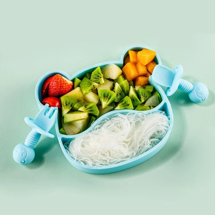 Set viewed from above, showing the divided bowl and utensils