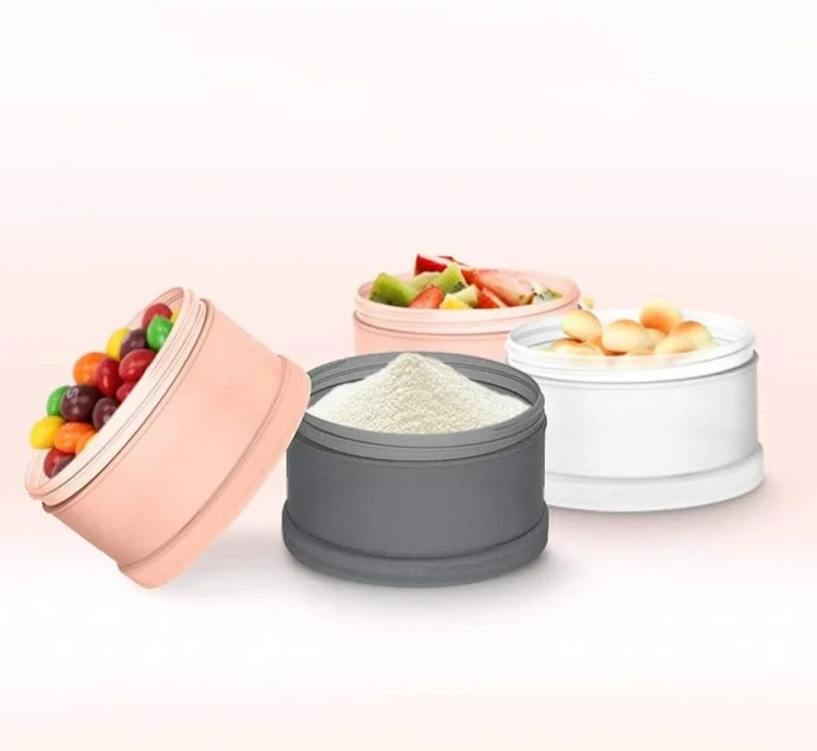 Dispenser with one compartment open, filled with milk powder