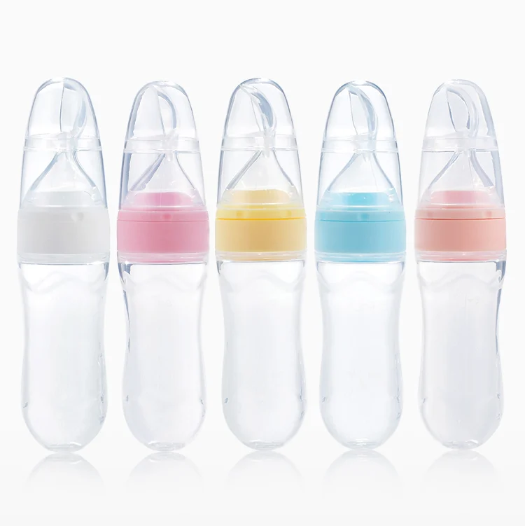 Pink 90ml silicone squeeze feeder with spoon and protective cap